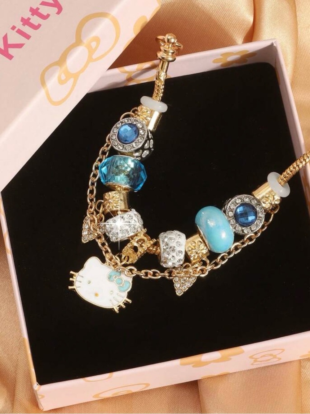 Hello Kitty Gold Bracelet with Blue and White Charms